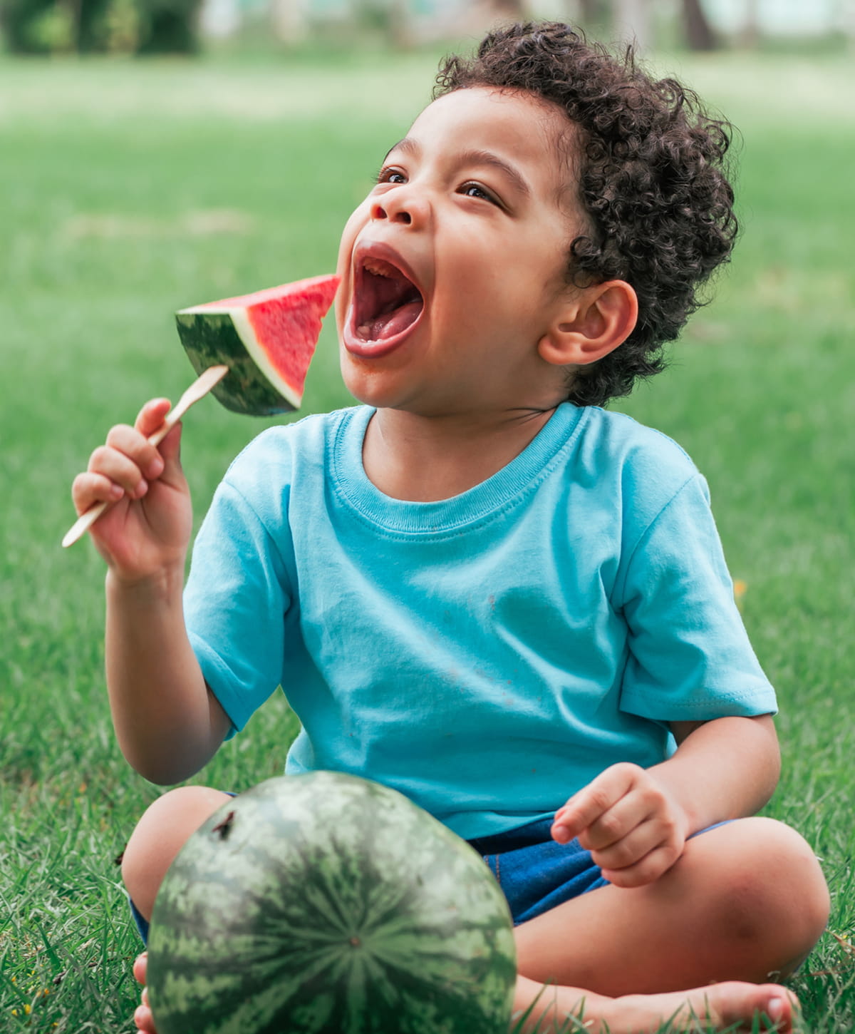 San Diego food allergies models mother and son eating watermelon